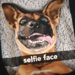 A t-shirt with a dog on the front